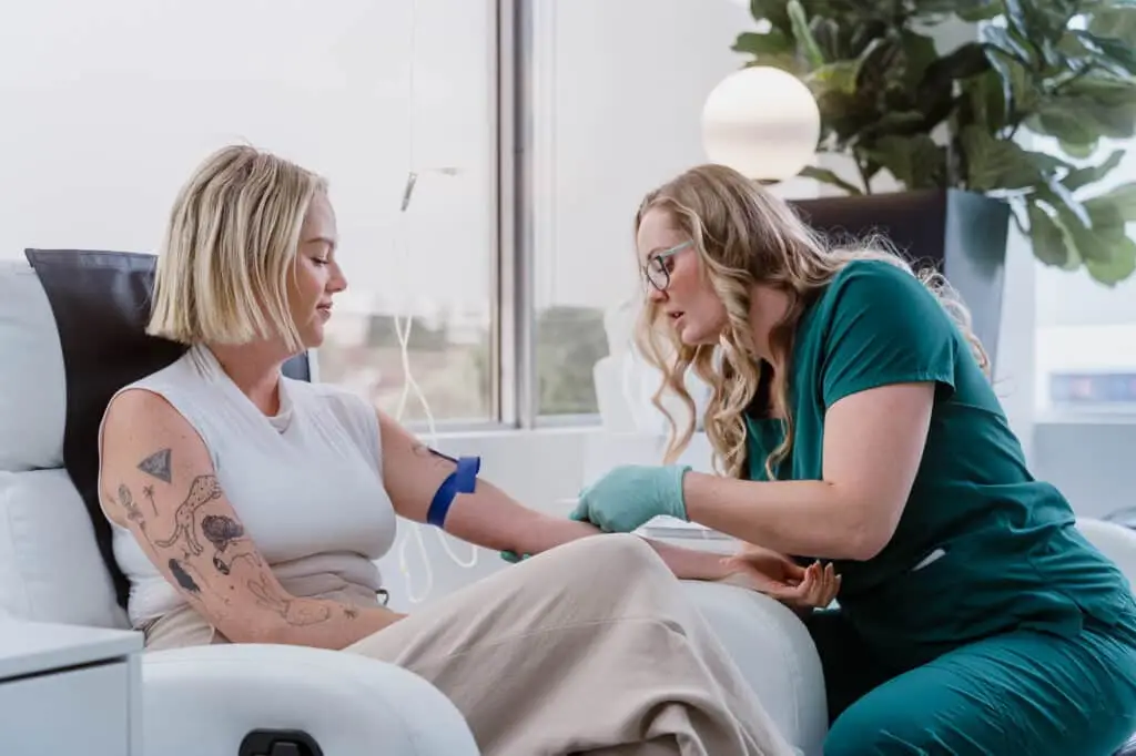 Doctor administering IV therapy