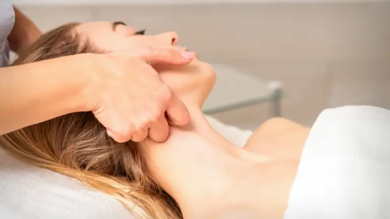 Woman receiving lymphatic drainage massage