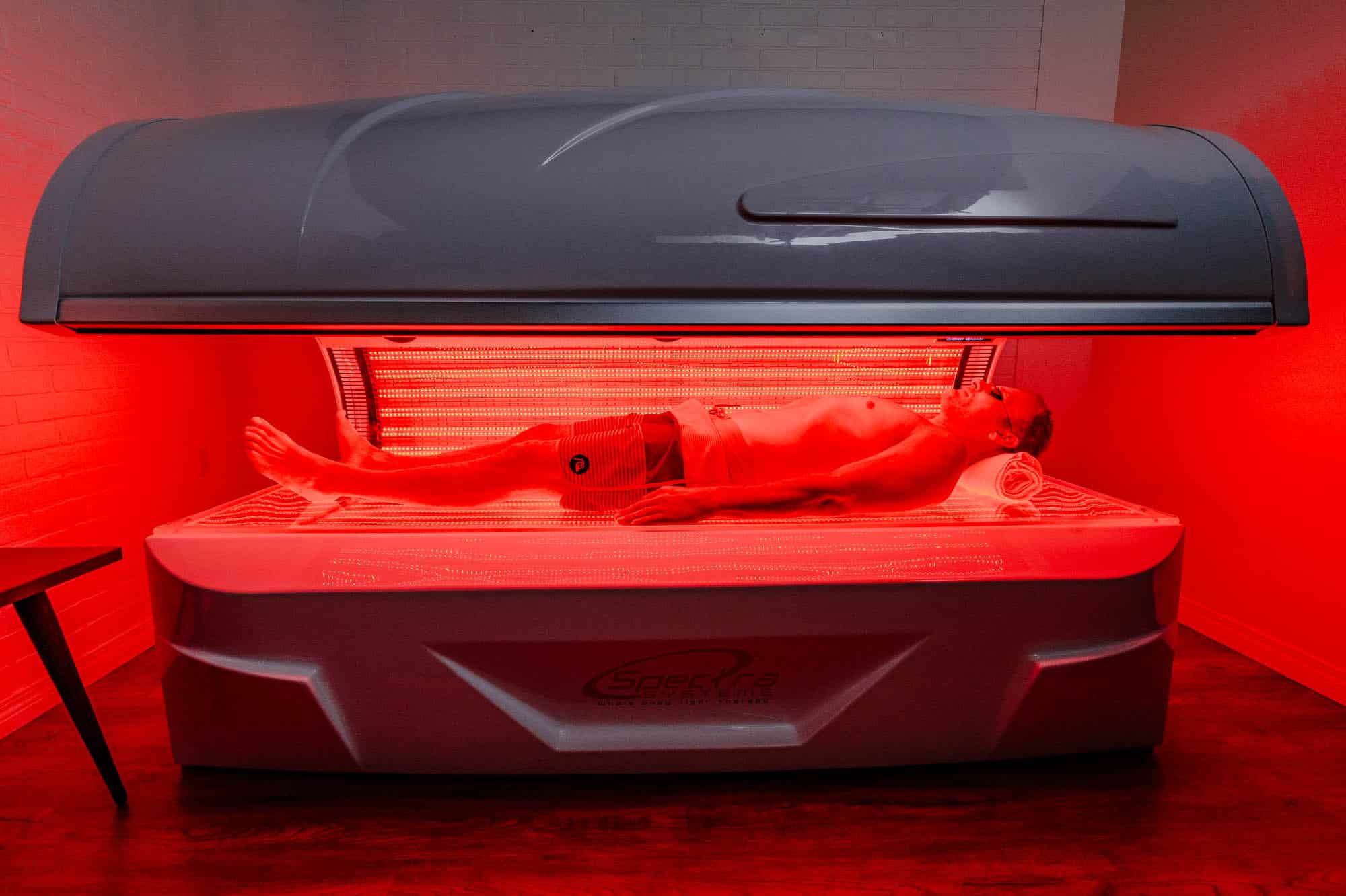 How long does red light therapy take to work? Here is a patient in a red light therapy bed