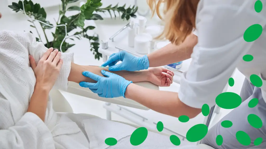 I nurse administering IV therapy to a patient