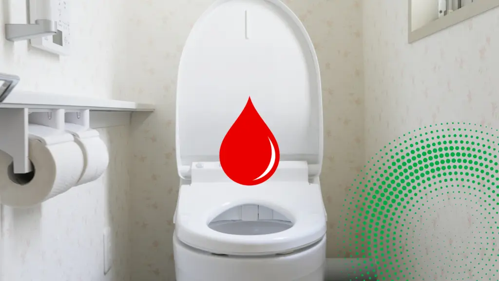 A bathroom with a graphic of a drop of blood to signify blood in still