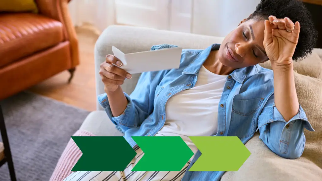 A woman in perimenopause suffering from a hot flash on her couch