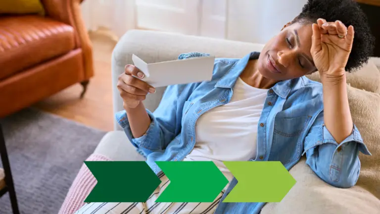 A woman in perimenopause suffering from a hot flash on her couch