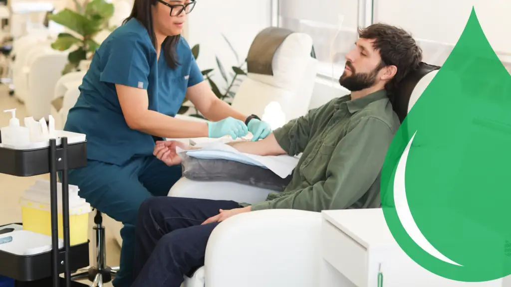A patient receiving IV therapy from a nurse at Vitality BioMed